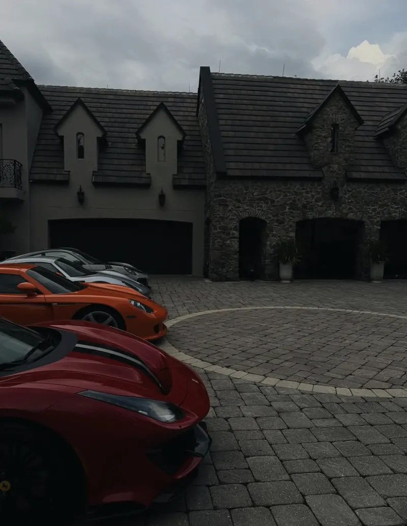 The cars lined up in front of the house