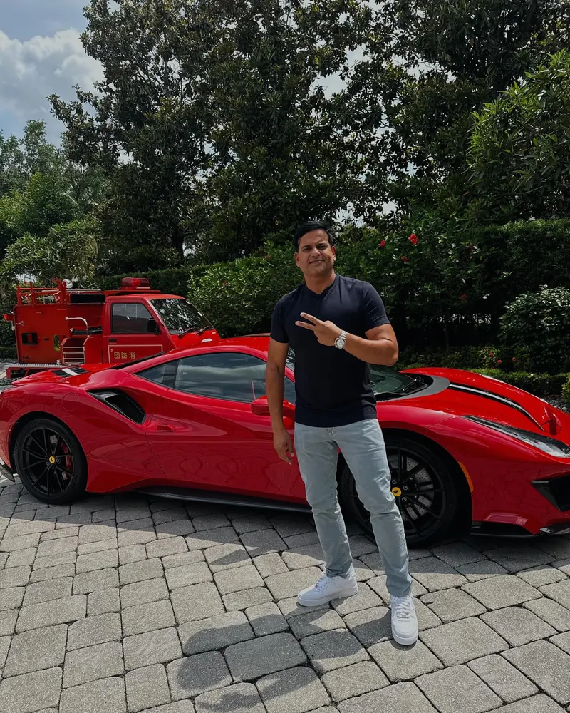 Kamran Farid beside his red Ferrari 488 Pista